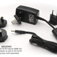 A black DermLite charger with a black plug for international adapters and as a replacement charger.
