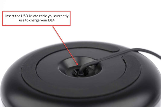 A black [Charging Base for DermLite DL4] device with a black cord attached to it.