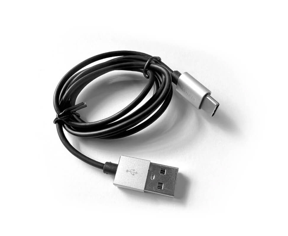 A black Type C USB Charging Cable (DL5/GL/Lum2/Handyscope) connected to a white surface. (Brand: DermLite)