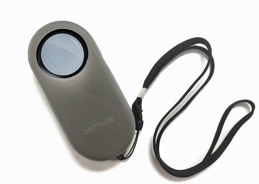 A small DermLite camera with a Lanyard for Dermatoscopes attached to it.